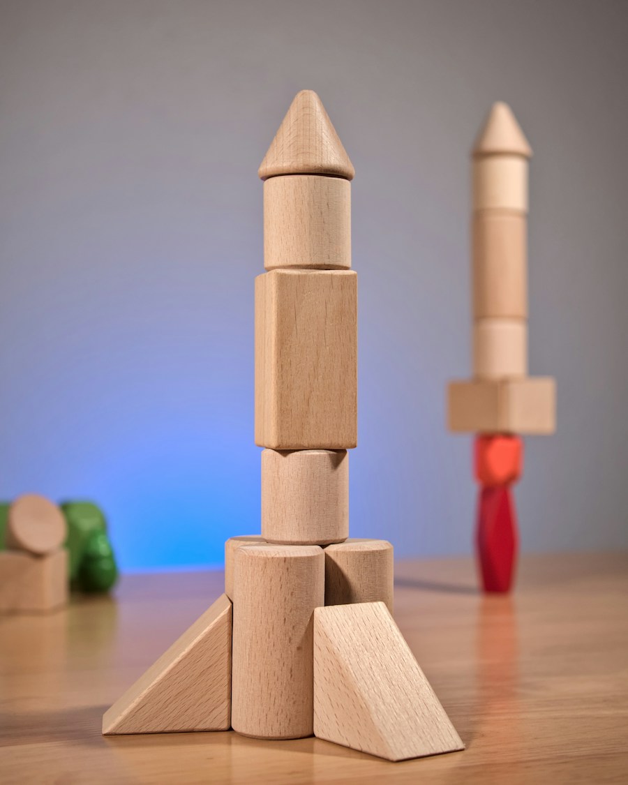 Natural wooden blocks arranged as a tall toy rocket